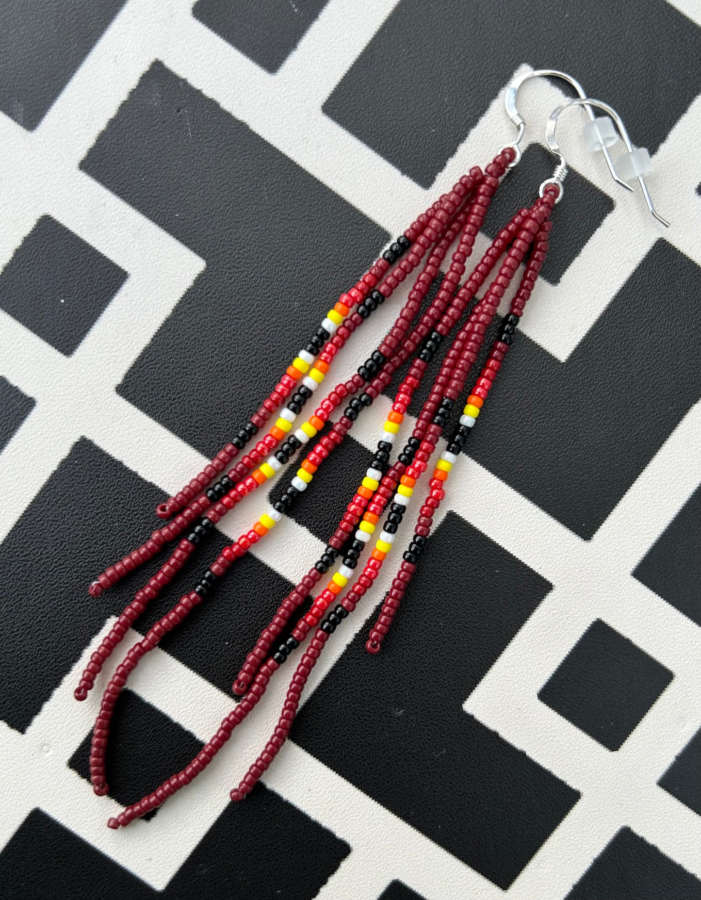 ᐄᔨᔥᑯᑖᐤ iiyishkutaau/fire earrings