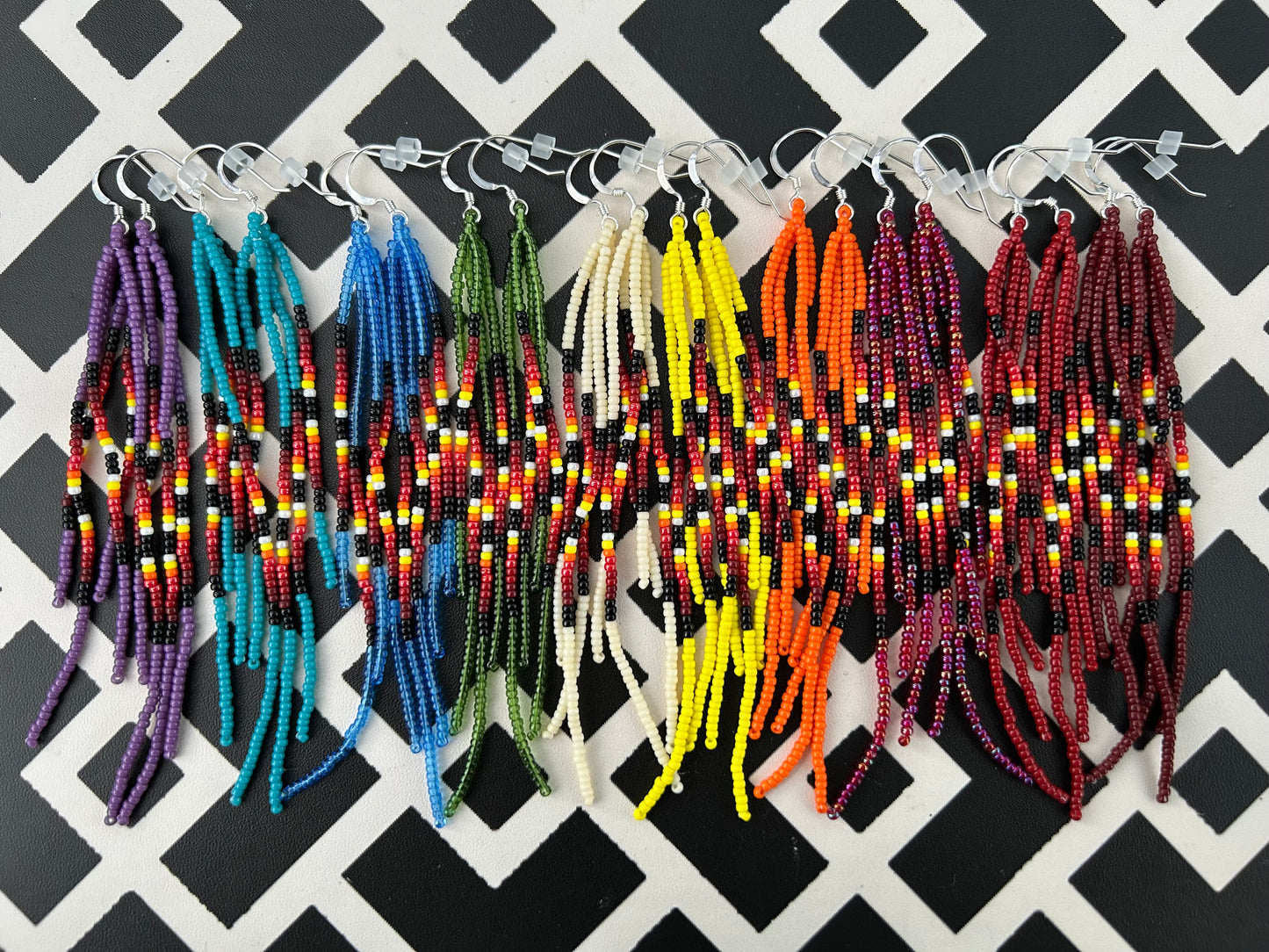 ᐄᔨᔥᑯᑖᐤ iiyishkutaau/fire earrings